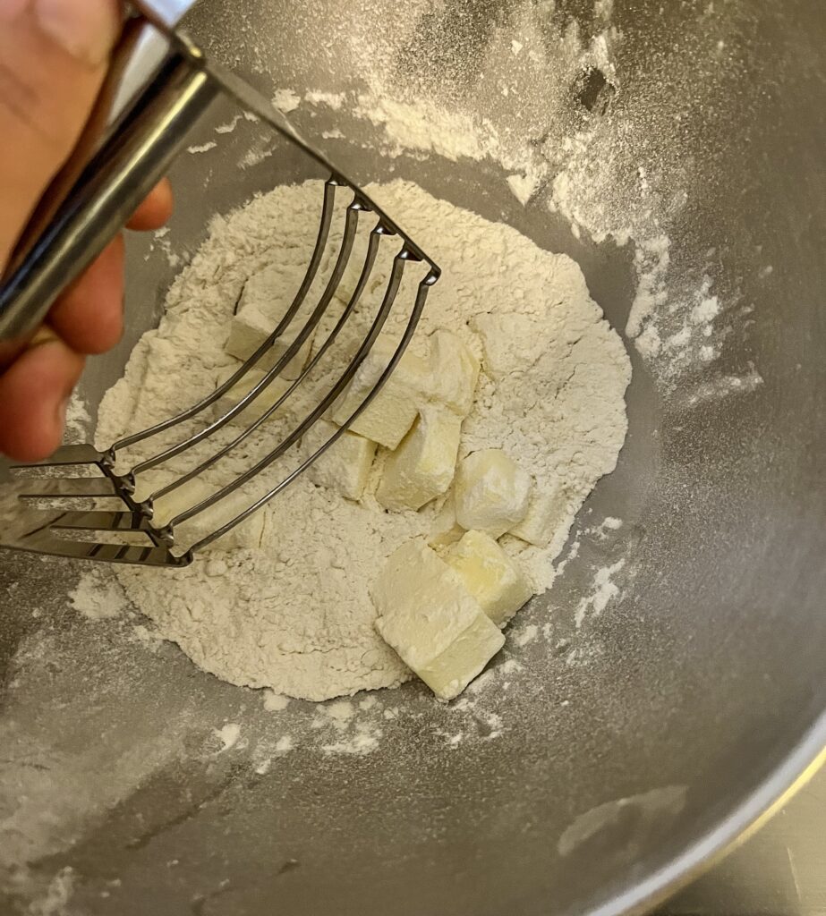 cutting butter into flour with a pastry cutter