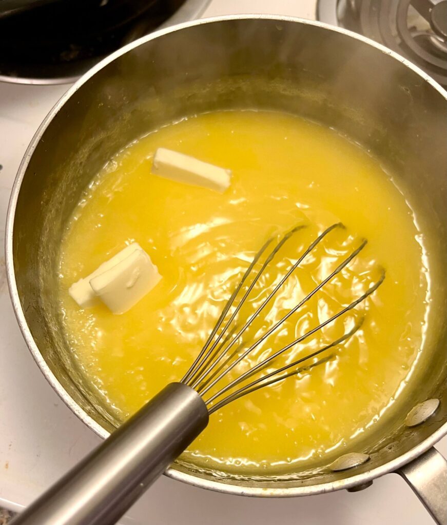 adding butter to lemon curd
