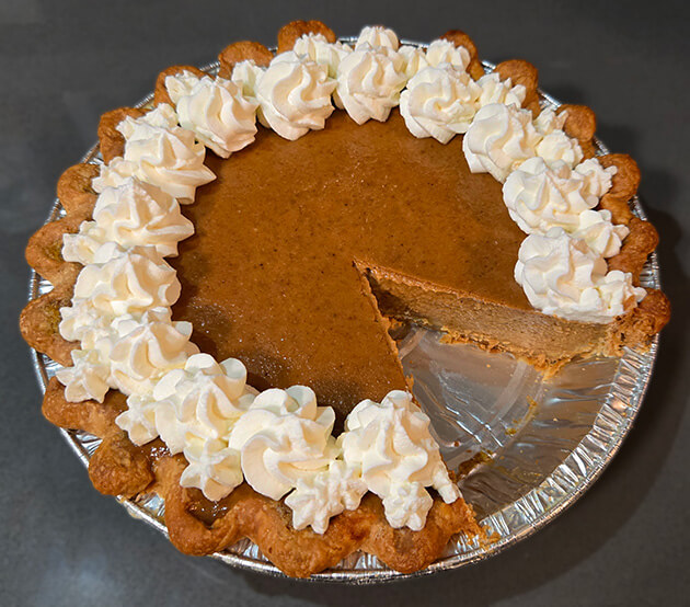 cross section of pumpkin pie with slice cut out