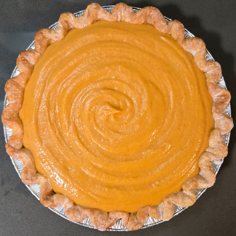 overhead photograph of a brown butter sweet potato pie before it's baked