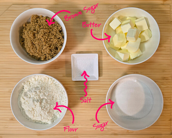 the ingredients for crumble, cubed butter, brown sugar, flour, salt, and sugar, with text overlay