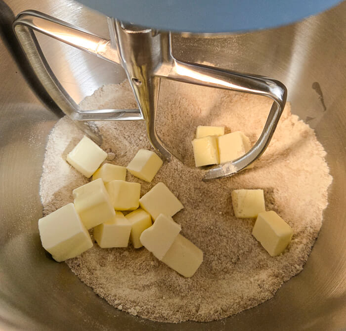 cutting the butter into the dries for crumble