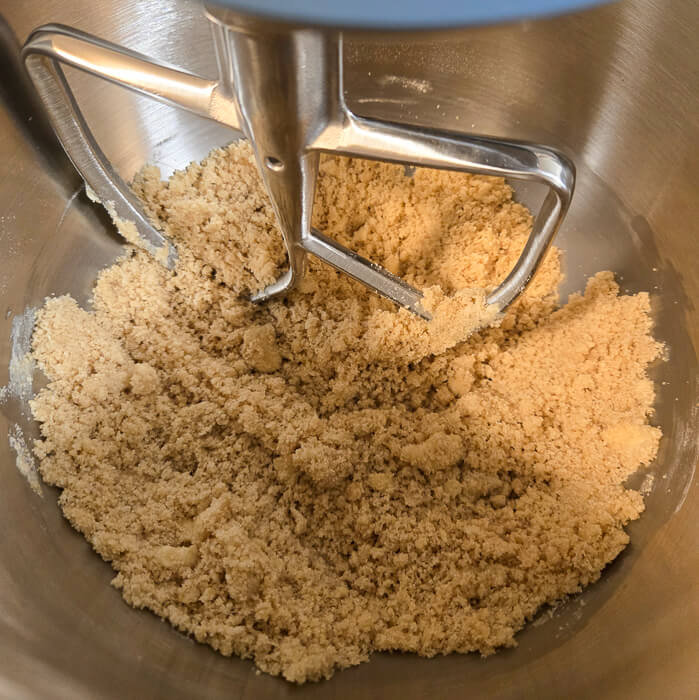 crumble that has just been made in a mixing bowl