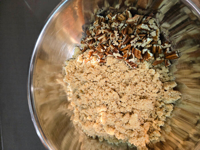 pie crumble and pecans in a bowl