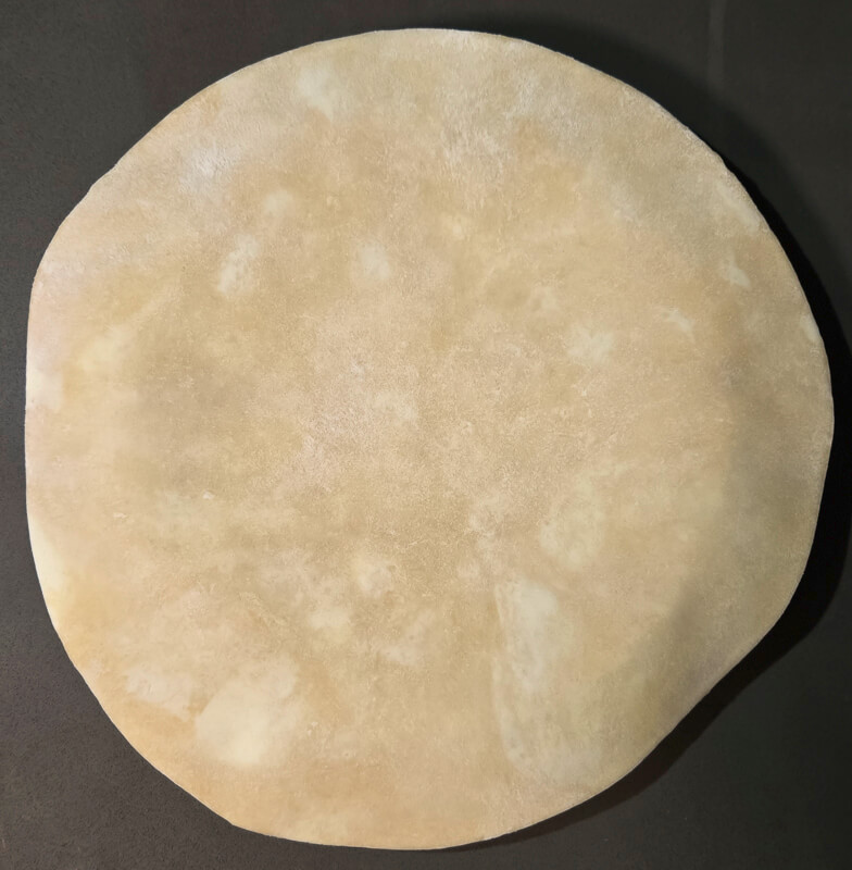 centering pie dough over a pie tin