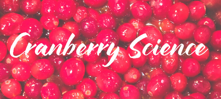 a photo of cranberries with a text overlay that says "cranberry science"