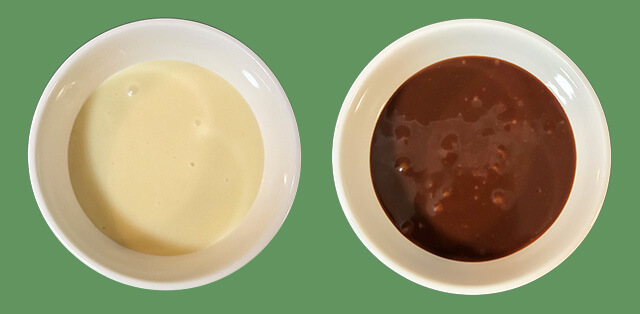 an overhead shot of white chocolate ganache and dark chocolate ganache on a green background