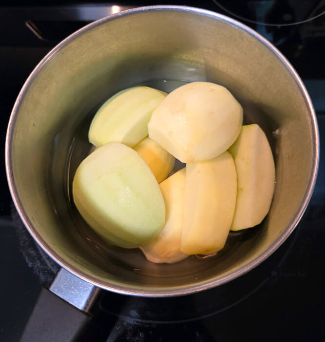 chunks of apple in a pot for stewing