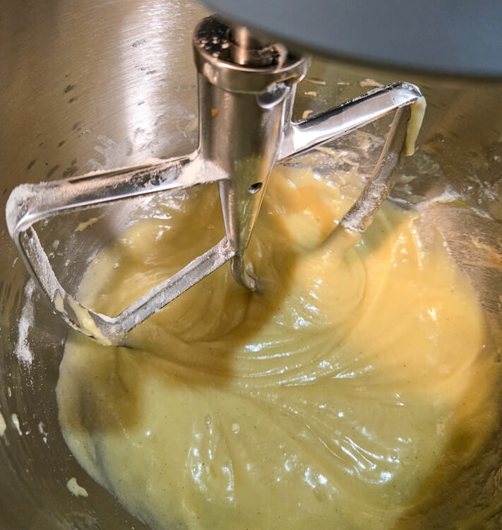 close up photo of a cake batter in a stand mixer