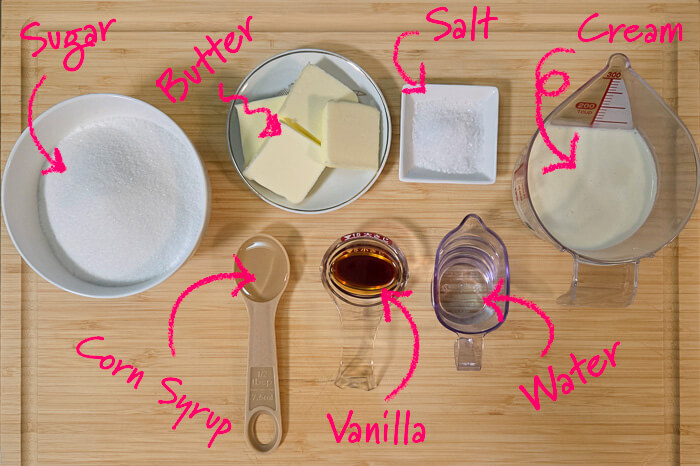 photo of the ingredients needed for salted caramel sauce: granulated sugar, unsalted butter, salt, heavy cream, corn syrup, vanilla extract, and water