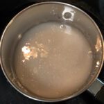 photo of a pot with sugar dissolved in water