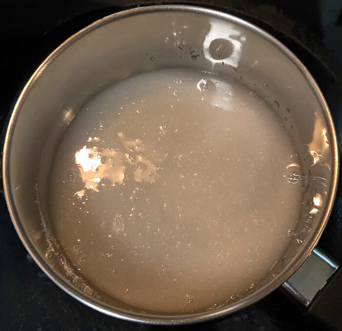 photo of a pot with sugar dissolved in water