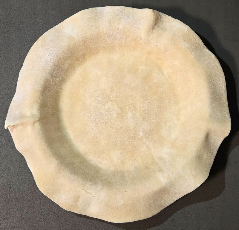 pie crust fitted into pie tin