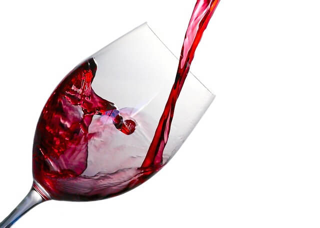 stock image of wine being poured into a wine glass