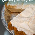 Old-fashioned butterscotch pie with whipped-cream topping and golden crust, sliced to reveal smooth brown-sugar custard filling.