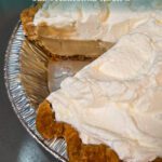 Homemade butterscotch pie with whipped-cream topping and golden crust, featuring Doggone Baking logo in corner for branding.