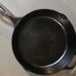 an overhead photo of a well seasoned cast iron skillet