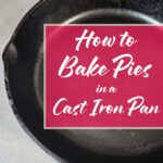 Top view of a black cast iron skillet on a kitchen counter, used for baking pies with golden, flaky crusts.