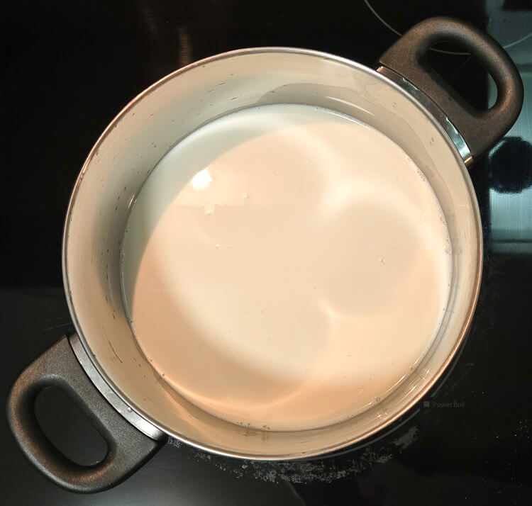 cream and milk in a pot on a stovetop