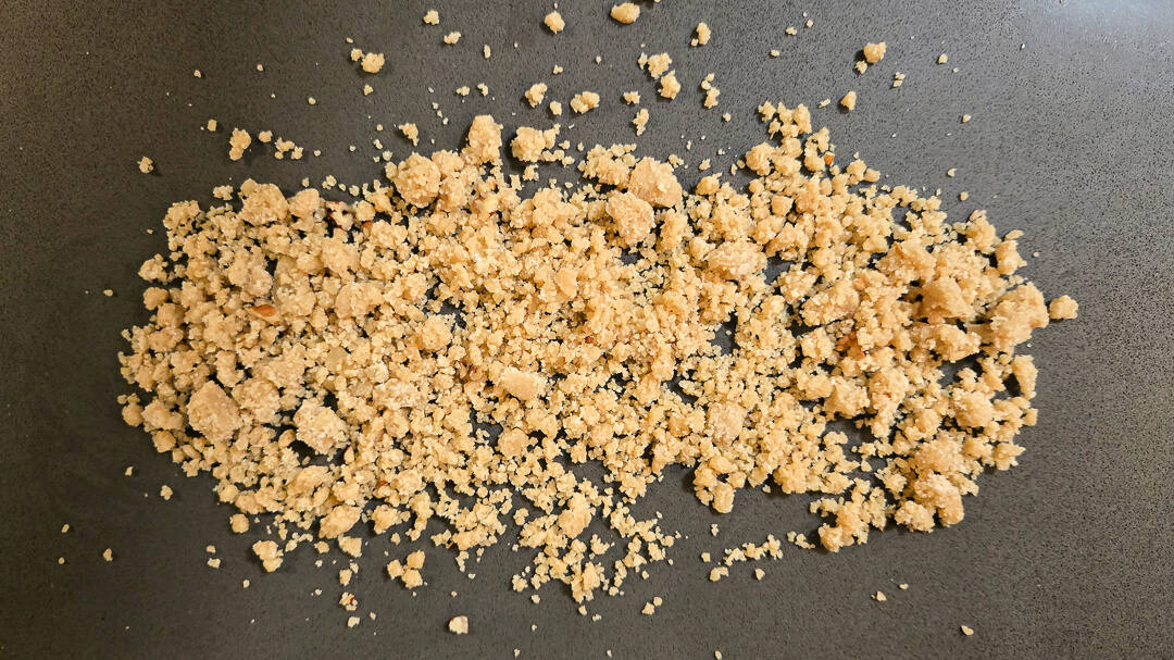 overhead photo of freshly mixed crumble spread over a countertop