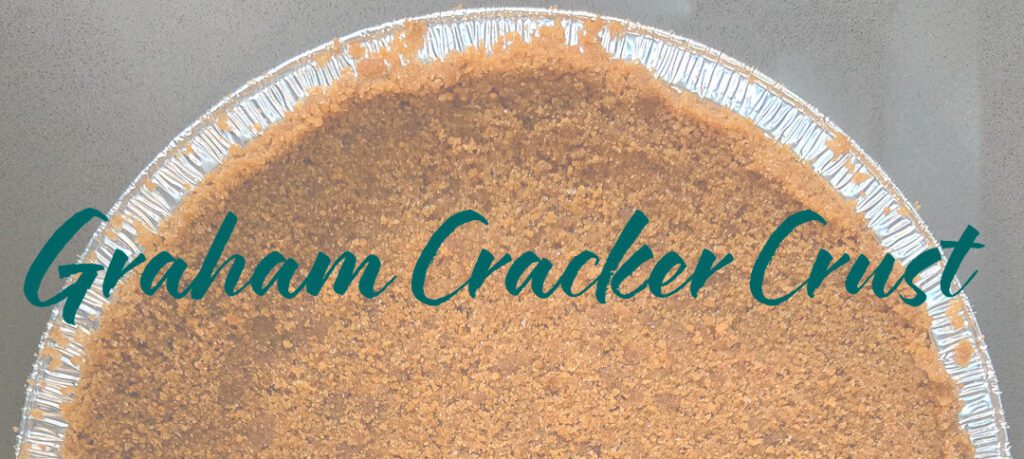 An overhead photo of half a graham cracker pie crust for graham cracker crust recipe with text overlay that says "Graham Cracker Crust"