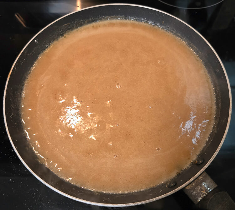 turkey gravy being made on a stovetop