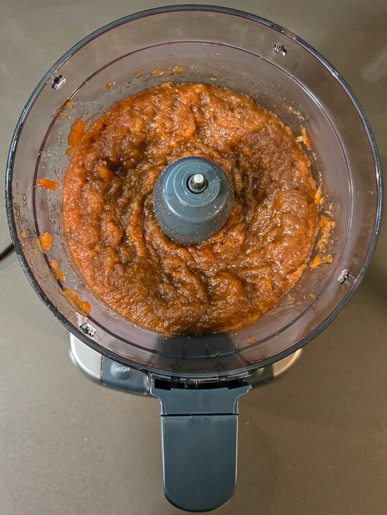 an overhead photo of schnitz apple pie filling in a food processor