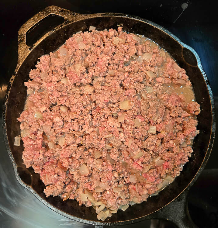 tourtière meat filling in the process of being cooked