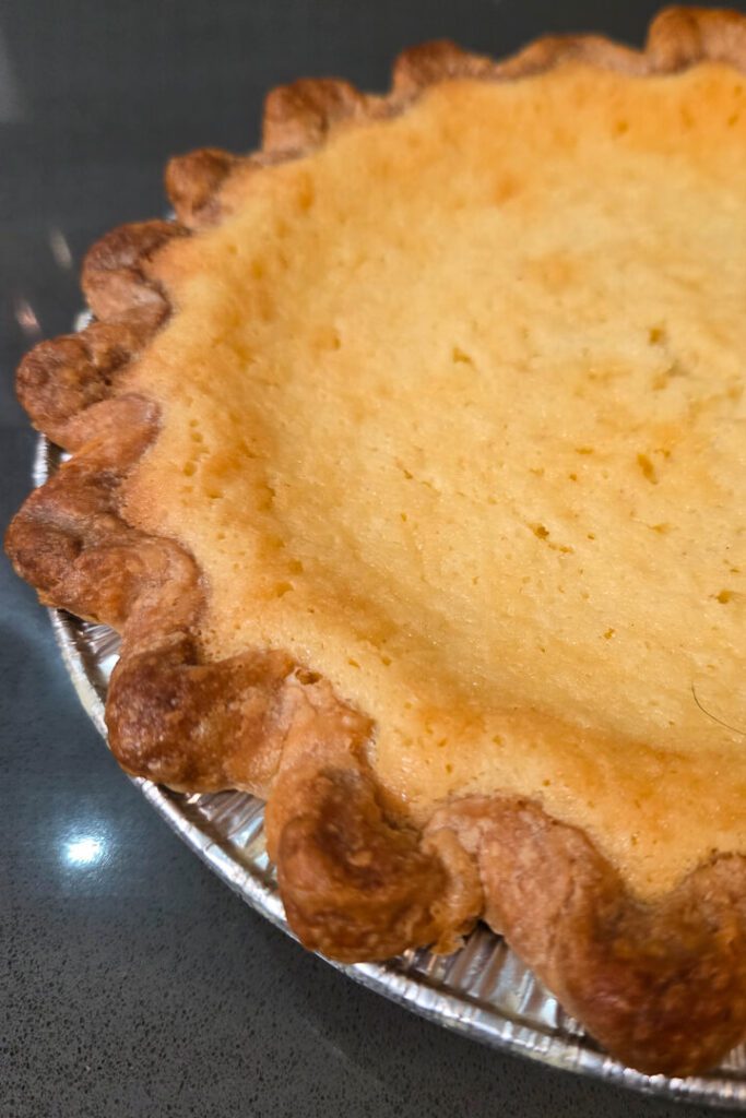 a close up photo of a freshly baked buttermilk pie