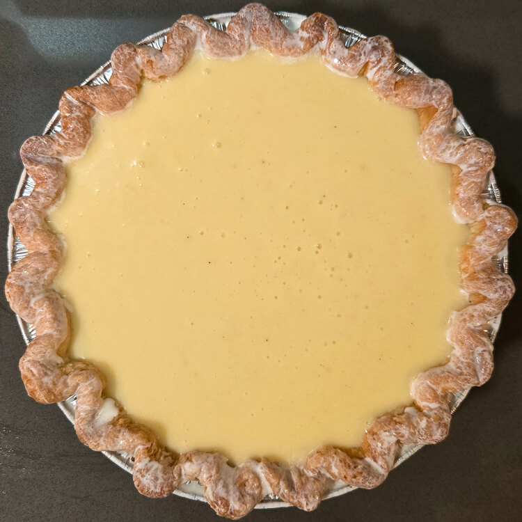 an overhead photo of an unbaked buttermilk pie
