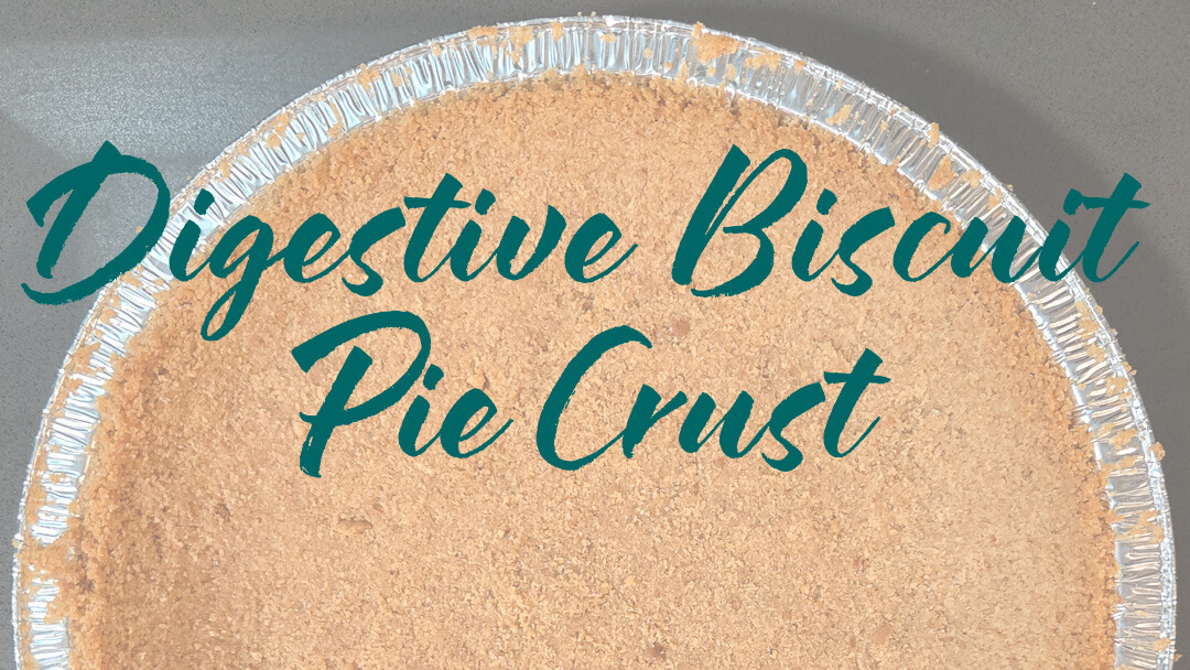 overhead photo of half of a crumb crust for a pie with text overlay that reads "Digestive Biscuit Pie Crust Recipe"