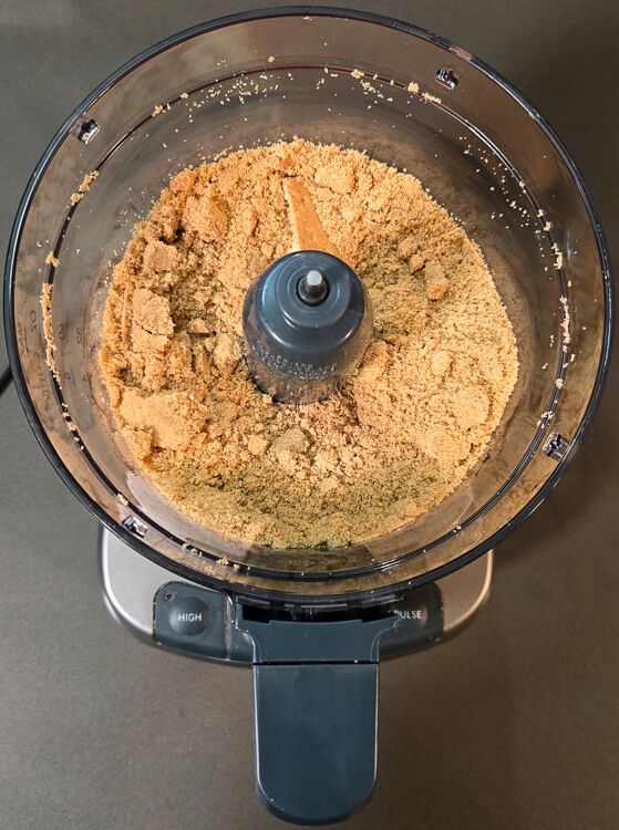 overhead photo of digestive biscuits after being ground down to crumbs in a food processor