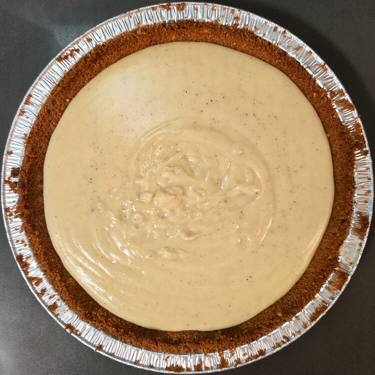 overhead photo of an eggnog cream pie with no whipped cream topping