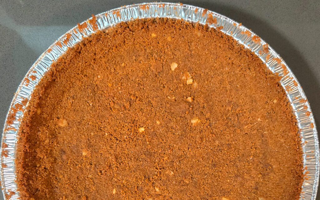 overhead photo of a a spiced festive gingerbread cookie pie crust