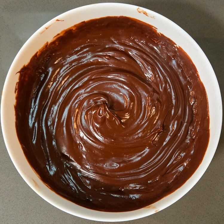 smooth chocolate haupia mixed in a white bowl