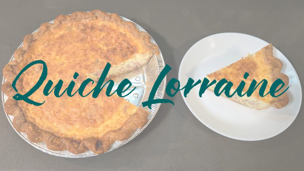 an overhead photo of a quiche lorraine with a slice cut out and placed next to it on a white plate with text overlay that reads "Quiche Lorraine"