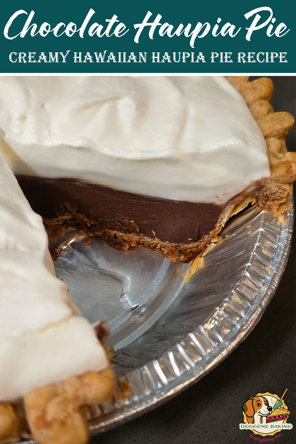 A close up of a chocolate haupia pie with a thick layer of chocolate haupia topped with fluffy whipped cream inside a flaky pie crust, shown with a slice removed to reveal the smooth, glossy chocolate filling.