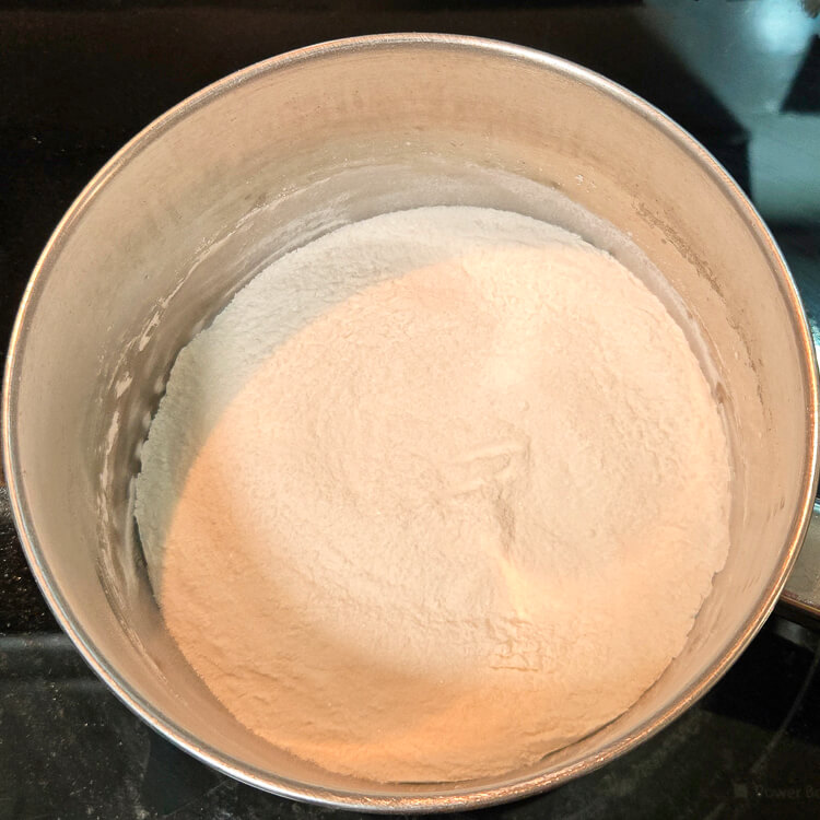 a mixture of sugar and cornstarch in a metal pot