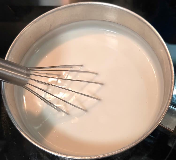 overhead photo of haupia being cooked on the stove