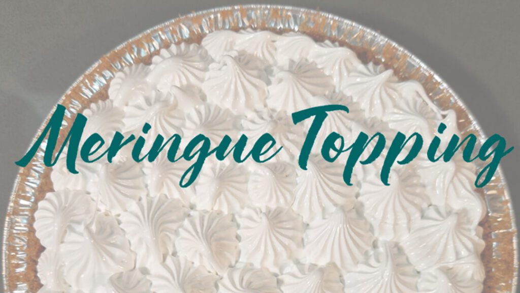 half of an untoasted meringue topped pie with piped swiss meringue with text overlay that reads "meringue topping"