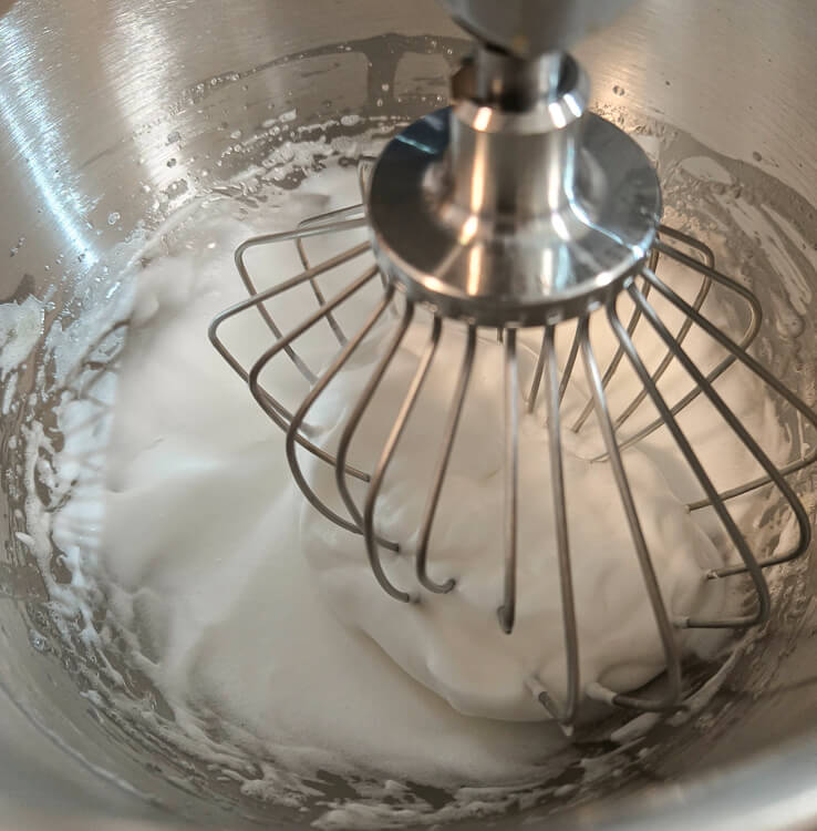 whipped egg whites. making meringue in a stand mixer with a whisk attachment
