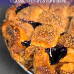 pinterest pin showing a close up photo of a baked blueberry pie with crimped pie crust edges, a golden brown lattice top, and juicy blueberry filling bubbling through.