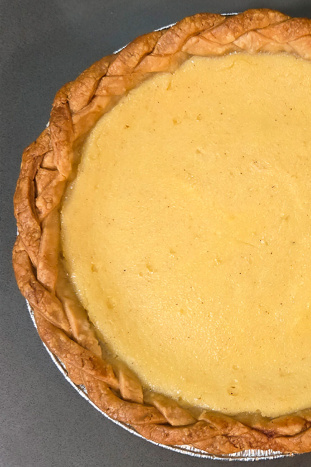 overhead photo of a marlborough pie with a braided crust