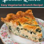 A close-up slice of extra cheesy and creamy spinach quiche on a floral plate, showing the rich spinach and Gruyère custard filling in a golden flaky crust.