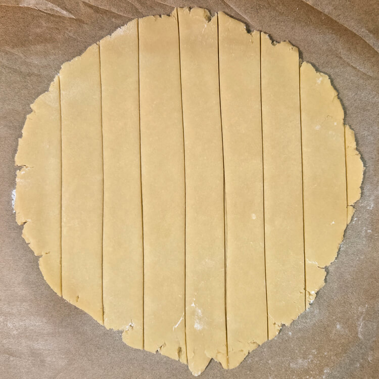 shortcrust pastry (pasta frolla) rolled out and cut into strips for latticing