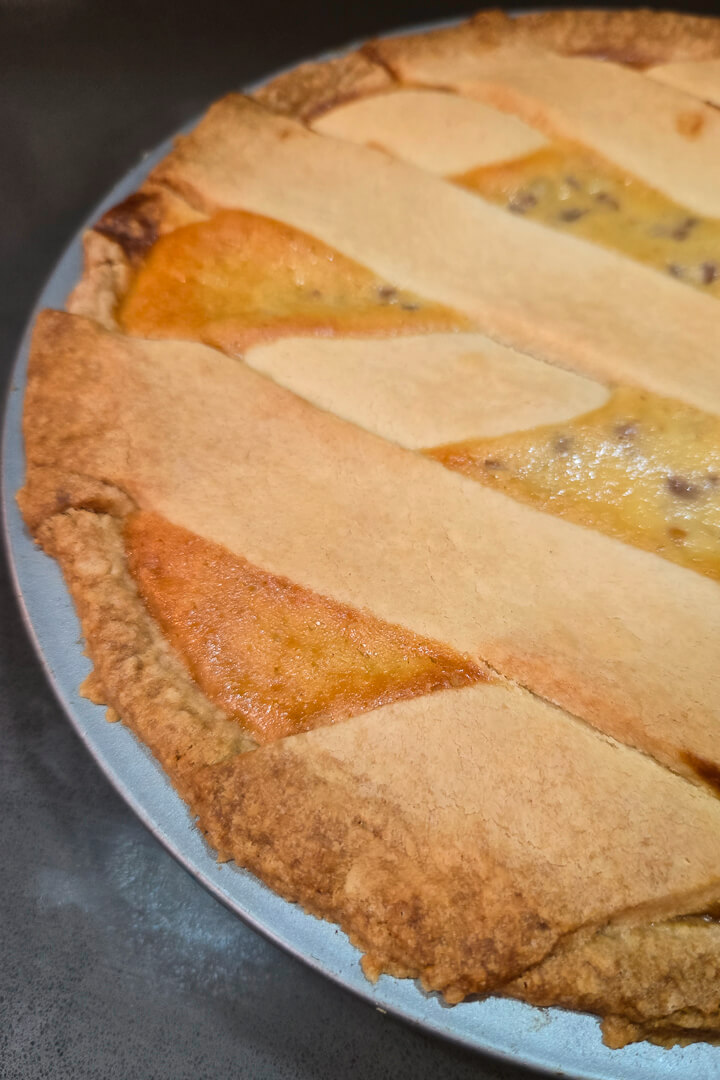Italian Easter Pie close up photo showing lattice made with shortcrust pastry and creamy ricotta filling