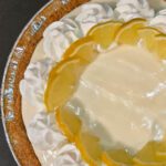 Frozen lemonade pie, an easy summer dessert for beginner bakers. Made with 4-ingredients to make a no-churn lemon ice cream in a graham cracker crust