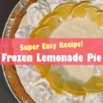 Overhead view of a frozen lemonade pie with a graham cracker crust, creamy lemon filling, whipped cream rosettes, and fresh lemon slices arranged on top