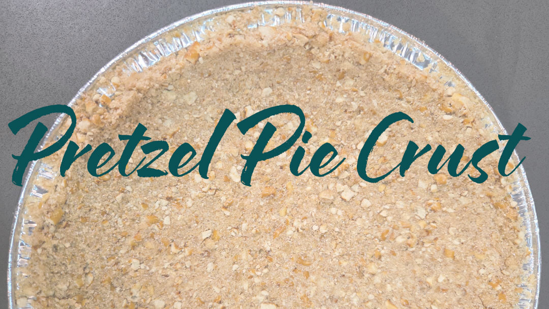 overhead landscape photo of a pretzel crust for pie. Text overlay reads "Pretzel Pie Crust"