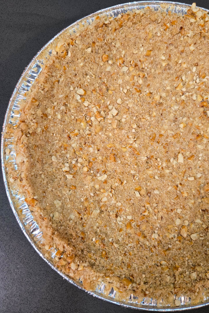 overhead portrait photo of a pretzel crust for pie